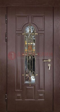 Темная железная дверь со стеклом и ковкой для частного дома ДСК-156 в Серпухове